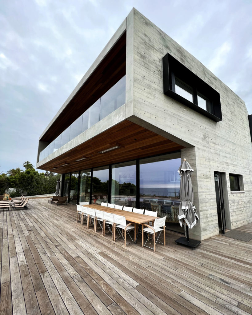 Exterior backyard view of Malibu home that utilizes a Messana Ray Magic® radiant ceiling system.