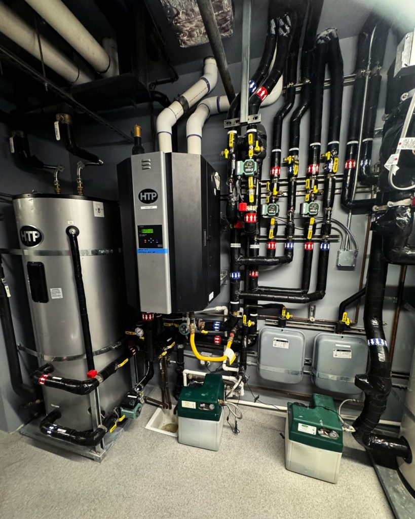 Mechanical room used to provide hydronic heating and cooling.