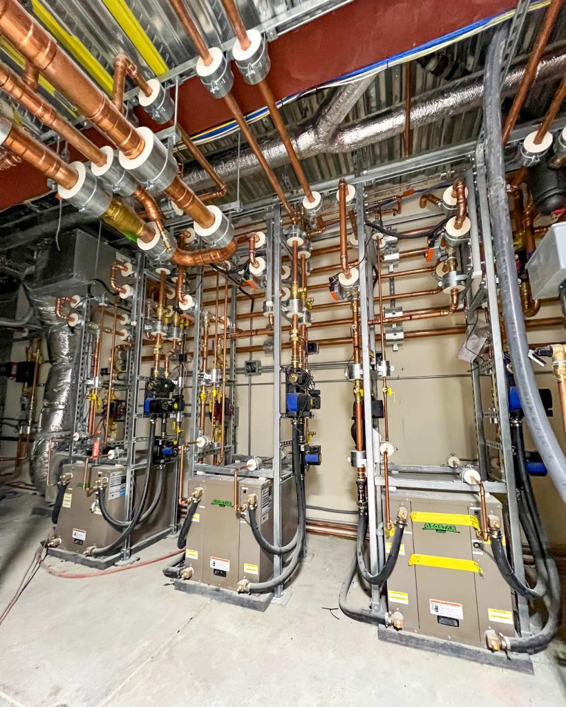 Three geothermal heat pumps, managed via Messana Controls, used for hydronic radiant heating and radiant cooling via a hydronic radiant floor.
