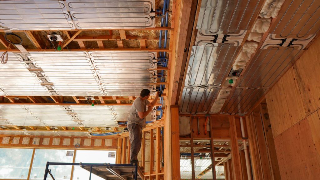 Hydronica Inc. insulating PEX piping to ensure condensation-free radiant cooling.