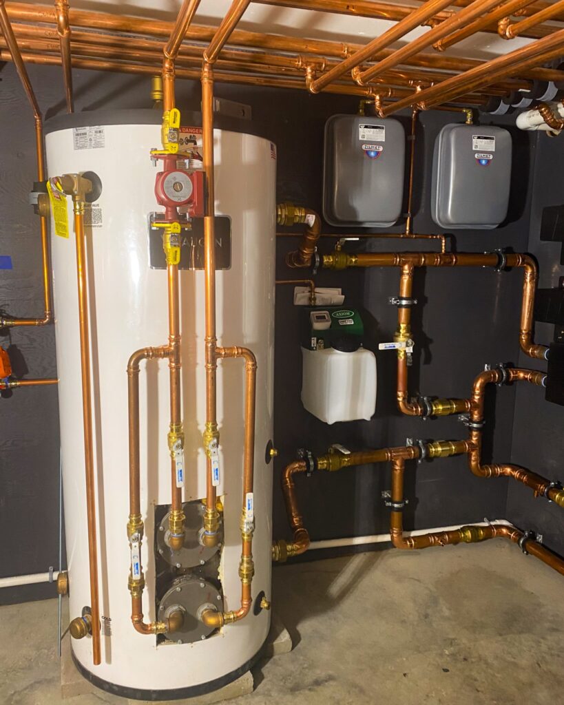 Mechanical Room used to provide geothermal hydronic heating and cooling via a radiant ceiling, radiant floor, and hydronic fan coil units. Managed via Messana Controls.